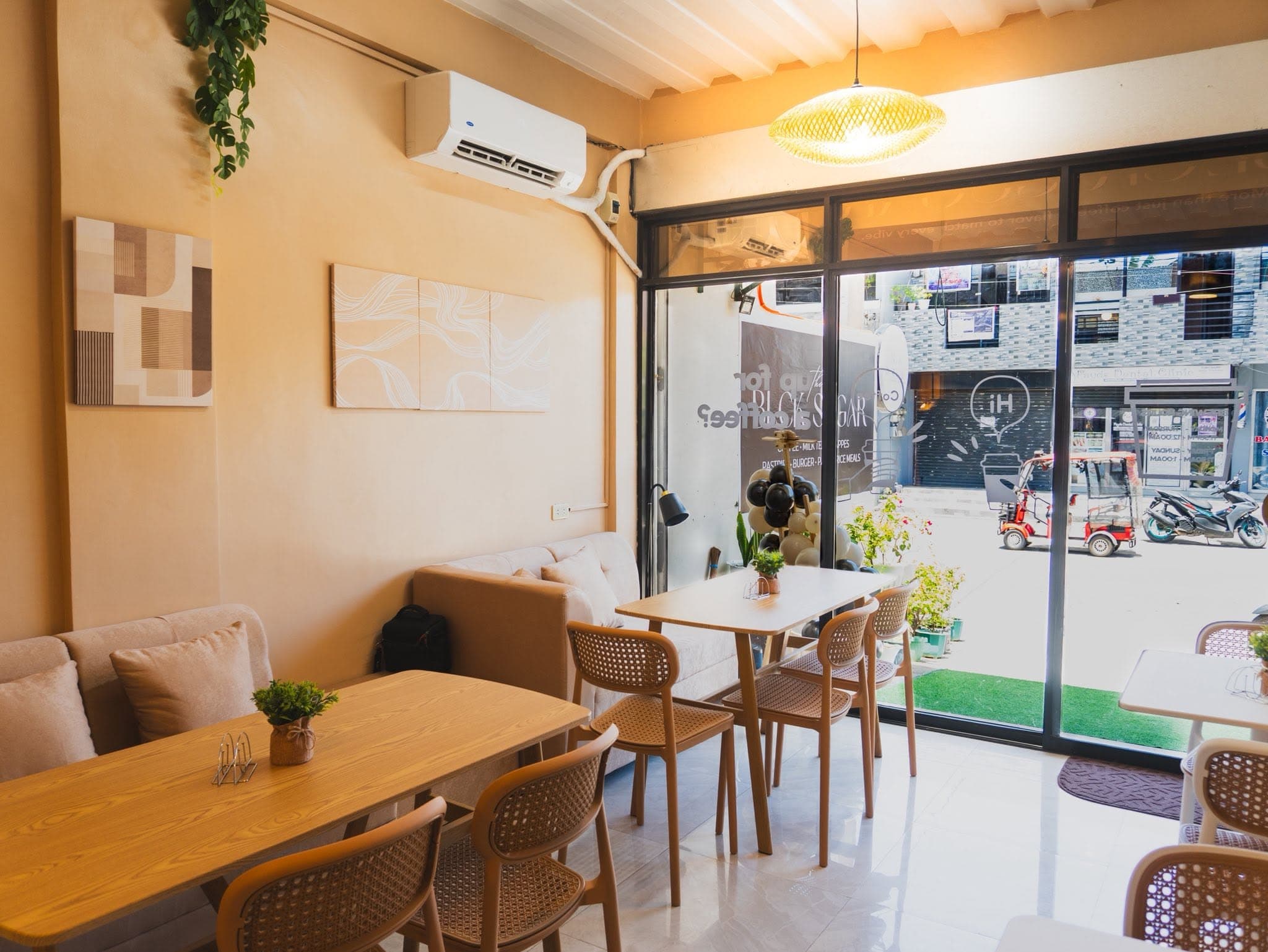 BLCK SUGAR cafe seating beside a bright storefront window